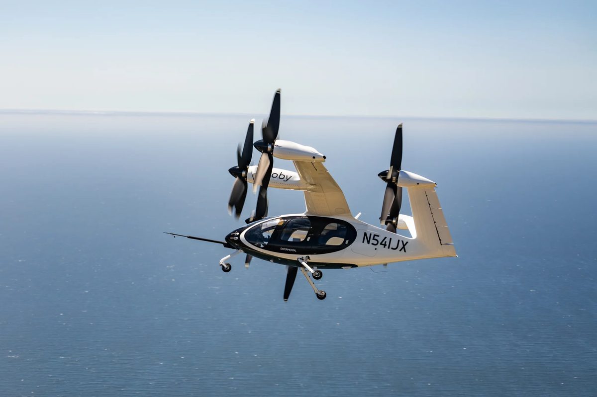 Joby S4 air taxi in flight over the water
